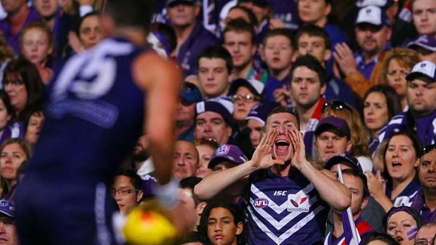 A Dockers fan reacts as Ryan Crowley takes possession of the ball.