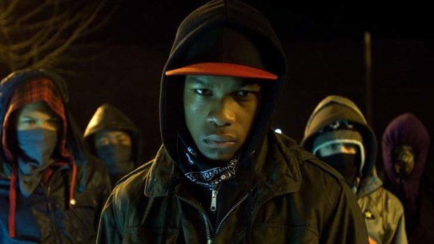 Teens in a London housing commission fighting to save their neighbourhood from alien monsters in <i>Attack the Block</i>.