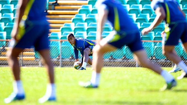 Pressure cooker &#8230; Will Genia initiates at play at Wallabies training at Leichhardt Oval yesterday.