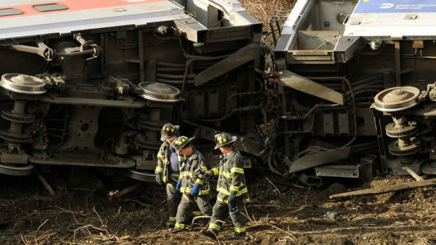 Emergency workers at the scene of a commuter train wreck in the Bronx borough of New York.