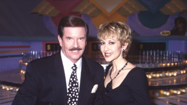 Adriana Xenides with John Burgess on the set of Wheel of Fortune.