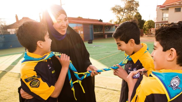 Proud Mum: Rasha Ahmed with her three sons Yahya, Younus and Dawoud Salman who were inducted into Australia's first ever all-Muslim cub scout group at the Australian International Academy's King Khalid campus (primary school) in Coburg on Tuesday.