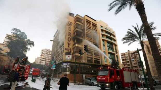 Fire engines work on extinguishing the fire after the blast in Beirut. 