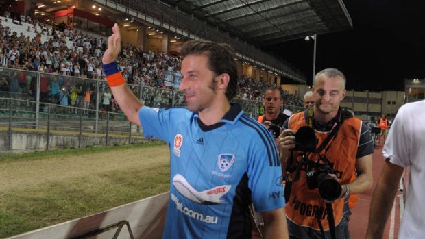 Alessandro Del Piero acknowledges the crowd after leaving the field.