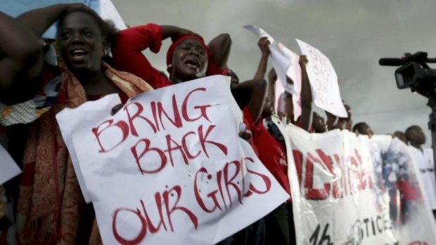 Women protest outside Nigeria's parliament in Abuja, demanding security forces to search harder for more than 200 schoolgirls abducted by Islamist militants two weeks ago.