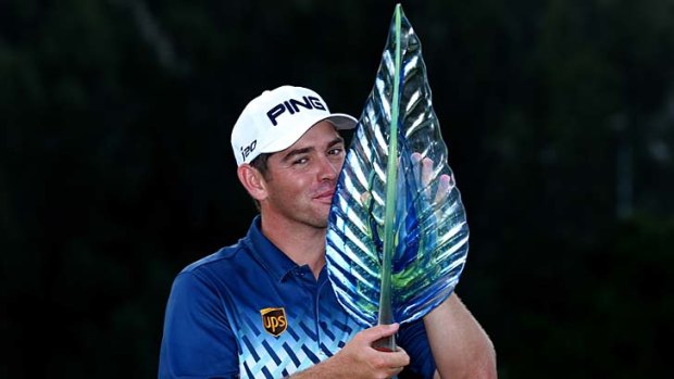 Louis Oosthuizen poses with the trophy.