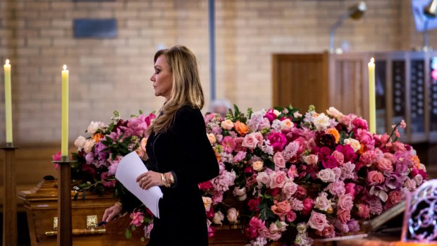 Lady Renouf's daughter, Ann Peacock, prepares to address mourners at her mother's funeral on Wednesday.