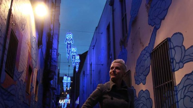 Love the night life ... Suzie Matthews, of the City of Sydney, in Kimber Lane, Chinatown yesterday. The council's strategy to boost the after-dark economy is on display.