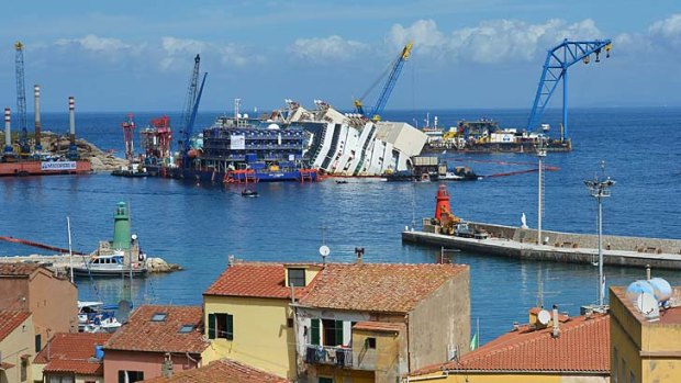 Raising the Concordia: The cruise ship begins to emerge near Giglio.