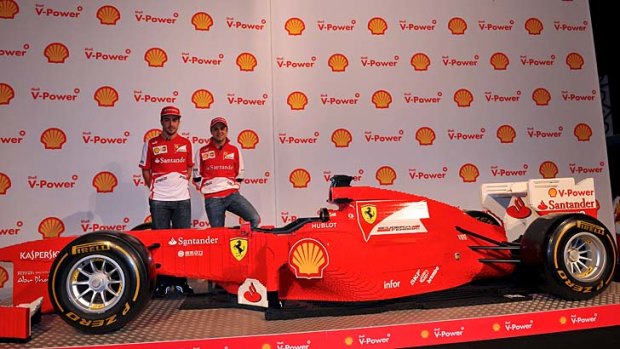 Ferrari drivers Fernando Alonzo and Felipe Massa unveil the lego Ferrari.
