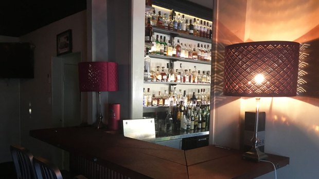 Blink and you'll miss the entrance to the teensy dimlit whisky lounge next door to the cosy main bar area in this cool café by day, bar by night.