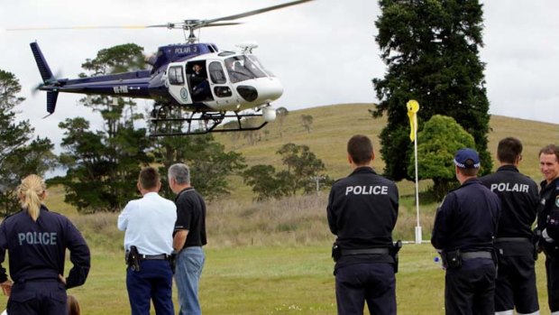 Police helicopters aid in the search for suspected murderer Malcolm Naden in bushland near Nowendoc, NSW.