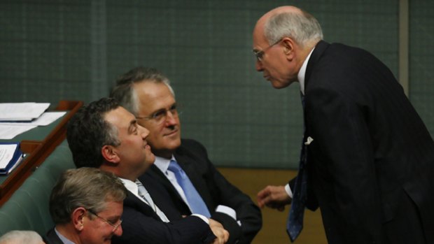 The former Prime Minister, John Howard, speaks to Joe Hockey and Malcolm Turnbull.