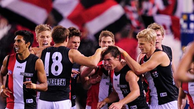 St.Kilda's Lenny Hayes is Mr Popular after a goal.