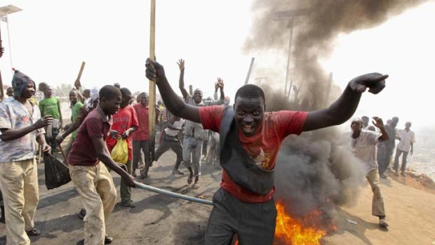 A burning barricade forms part of a demonstration on the outskirts of Abuja, Nigeria's capital.