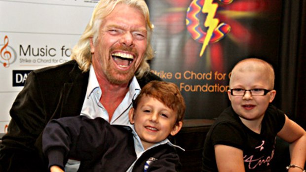 Sir Richard Branson meets Perth children Jarvis Brett, 6 and Evie Rogers-Elgae, 10 while visiting Perth today.