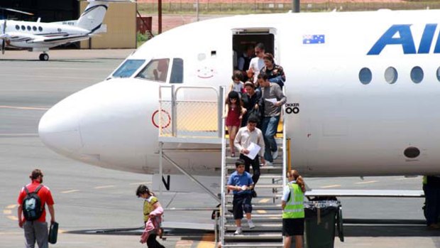 En route ... asylum seekers bound for Sydney at Hedland airport in Western Australia.