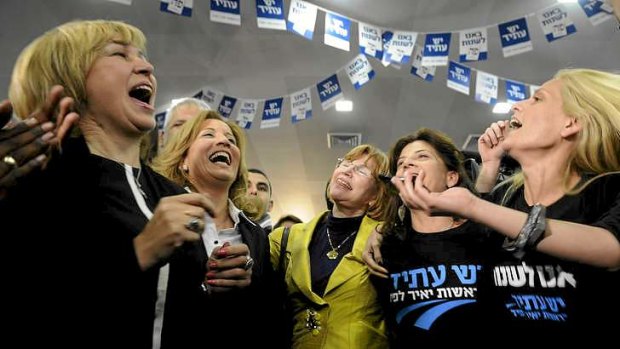 Supporters of the newly formed Yesh Atid (There is a Future) party celebrate in Tel Aviv.