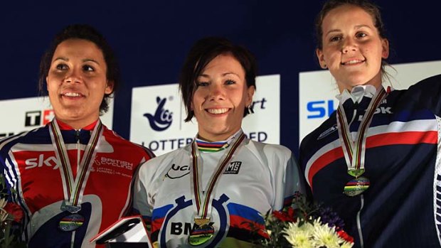 Shanaze Reade (second) of Great Britain, Caroline Buchanan (first) of Australia and Eva Ailloud (third) of France pose on the podium after the final of the Women's Time Trial on day two of the UCI BMX World Championships at NIA Arena in Birmingham, England.