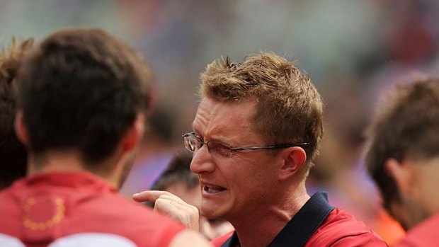 Frustrated: Melbourne coach Mark Neeld tries in vain to get his message across.