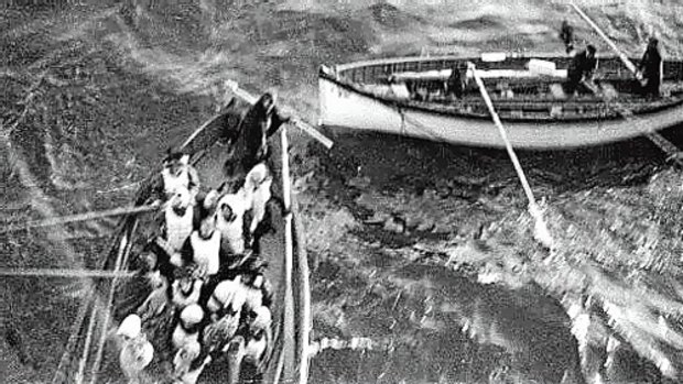 Titanic lifeboats approach the rescue ship Carpathia.