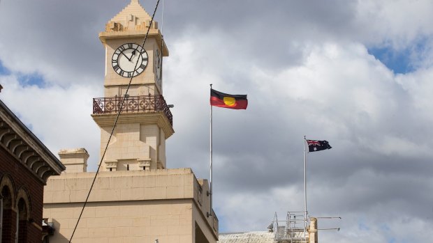 Flags flying over Richmond Town Hall, where Yarra Council took its controversial vote. 