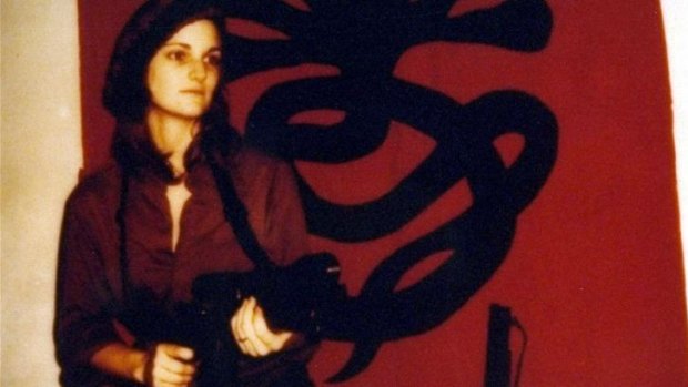 Patty Hearst totes a machine gun in a Symbionese Liberation Army poster.