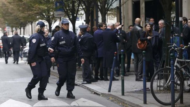 Making news: French police cordon off the area next to the newspaper offices.