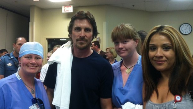 Christian Bale poses with medical staff in a picture posted on Twitter by the hospital.