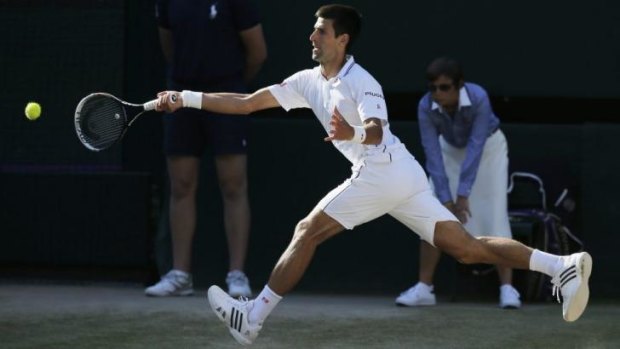 Novak Djokovic at full stretch against Roger Federer in the Wimbledon final on Sunday.