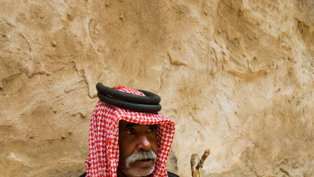 A Bedouin plays his stringed instrument in  Jordan.