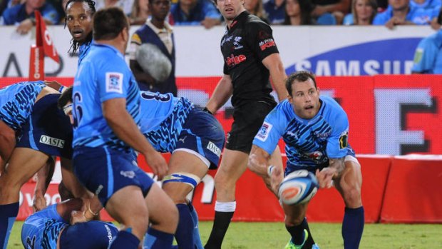 Francois Hougaard clears the ruck for the Bulls.