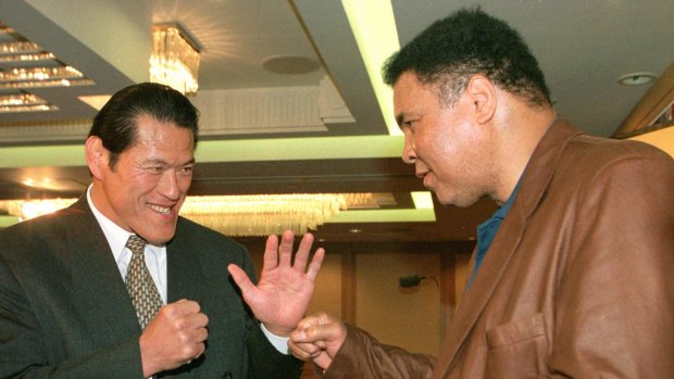 Reunion: Antonio Inoki, left, and Muhammad Ali meet again in Tokyo in 1998.