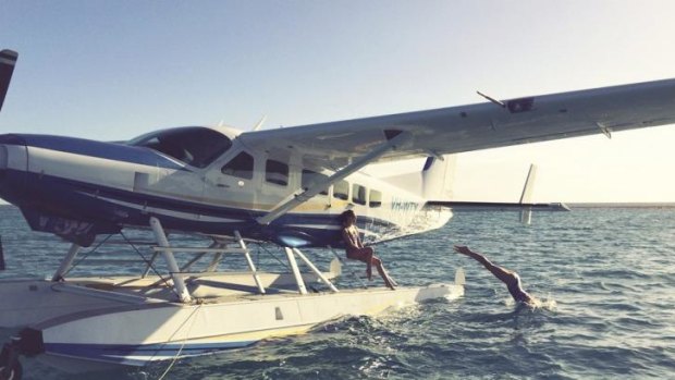 In cruise control: A seaplane lands on the Great Barrier Reef.