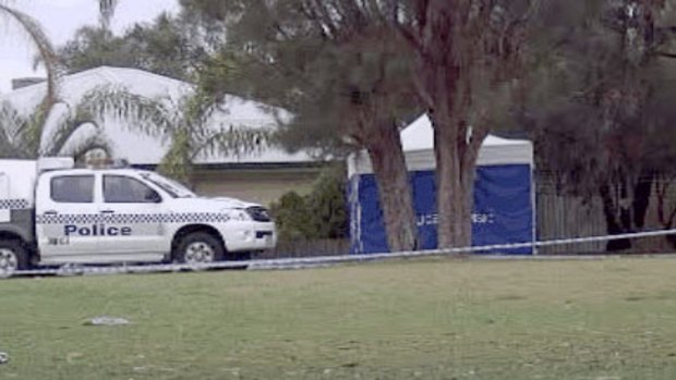 A police forensic tent covers a 20-year-old's body found stabbed to death in a Leda park.