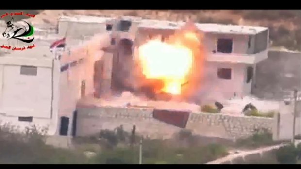 Footage supplied by the Free Syrian Army's Fursan al-Haq Brigade shows the moment of a US-supplied TOW missile's impact.