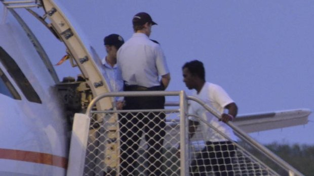 The first asylum seekers to be sent ot Nauru under the new Pacific Solution left Christmas Island last night.