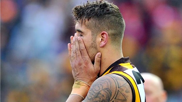 The pain: Lance Franklin finds it hard to face defeat after the final siren.