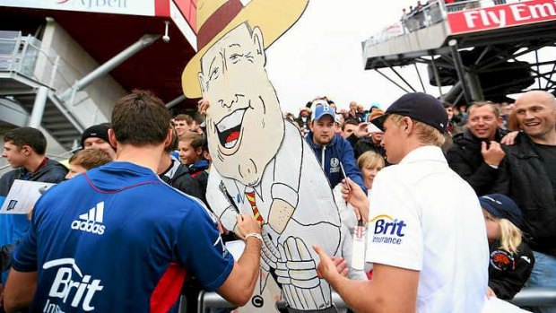 James Anderson and Joe Root of England sign a cardboard cut-out of Geoffrey Boycott.