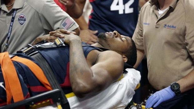 Stretchered off: Paul George is taken away for further treatment after suffering his leg injury during a Team USA scrimmage on August 1.