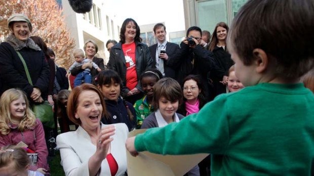 Making Julia smile &#8230; mothers and children rallied in support of the carbon tax yesterday. Unlike opponents of the tax, they were invited into the Senate courtyard.