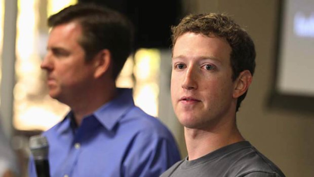Skype CEO Tony Bates, left, and Facebook CEO Mark Zuckerberg hold a news conference at Facebook headquarters in Palo Alto, California.