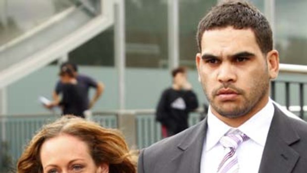 Melbourne Storm player Greg Inglis leaves the Sunshine Magistrates Court holding hands with his girlfriend Sally Robinson.