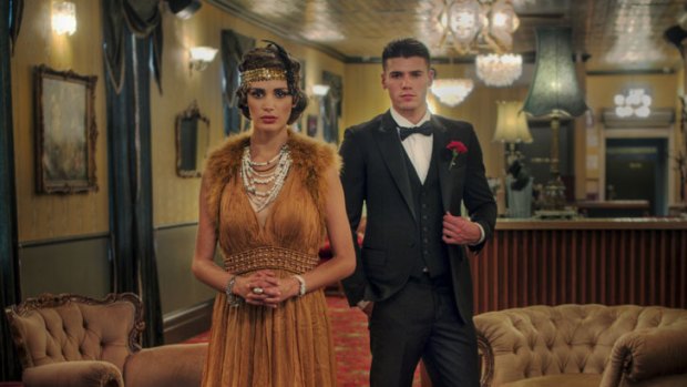 In the Back Bar in Windsor, Jake and Olivia, of Giant Management, model 1920-30s fashions before the Melbourne Fashion Festival. Olivia's gown is by Aurelio Costarella, Jake's suit by Arthur Galan.