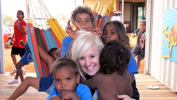 Hannah Newnham, education co-ordinator for the Gumala Aboriginal Corporation, with some of the children at the newly built learning centre in remote Western Australia.