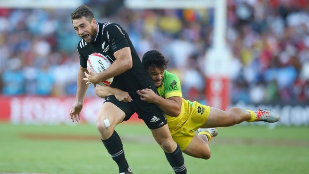 Joe Webber of New Zealand is tackled by Allan Fa'alava'au of Australia during the final.
