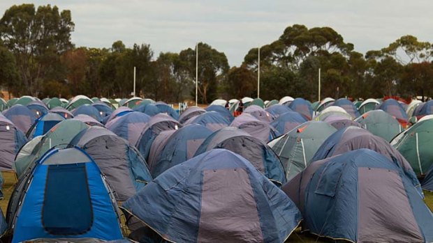 A sea of tents spreads across an oval in Heyfield for firefighters' accommodation.