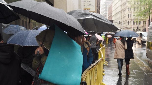 Customers queue outside the Sydney Apple store for the release of the iPhone 6s.