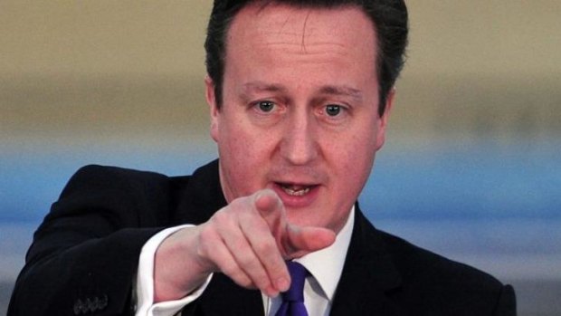 Your country needs you: David Cameron makes his point in London on Friday night.