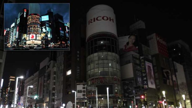 Lights out: Tokyo's famous landmarks are turning off the neon to conserve energy.
